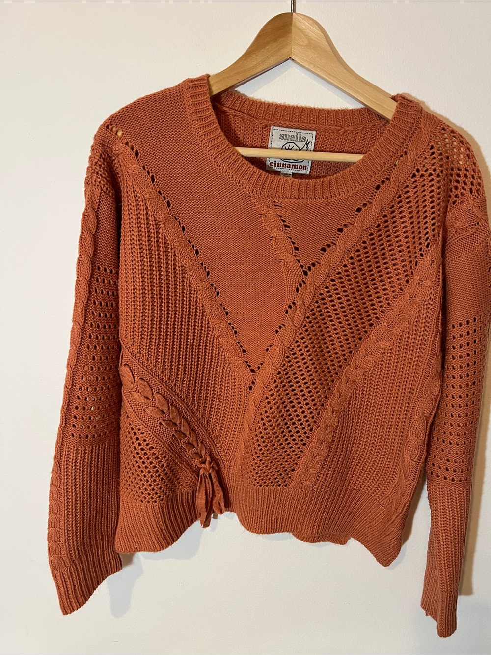 Cinnamon Girl Open-Knit Crewneck Sweater in Rust with braided bow details